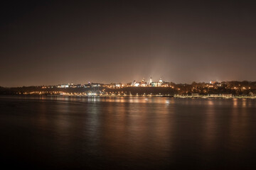 Nightscape of old Plock with Stanislav Gornicki embankment at night with lighting. Plock, Poland