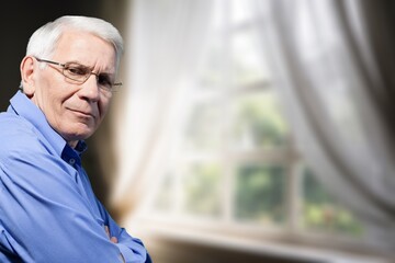 Senior happy old man portrait in room