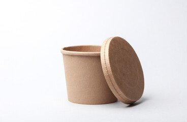 Craft take-away take-out food paper container, cardboard round disposable packaging box on white background