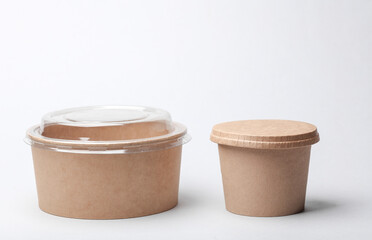 Craft take-away take-out food paper containers, cardboard round disposable packaging boxes on white background