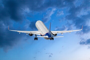 Commercial passenger modern airplane flying in sky