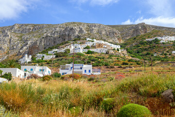 Greek white houses on the hillside in Aegiali village. Amorgos island, Greece