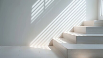 Obraz premium Minimalistic white staircase bathed in natural sunlight, casting shadows on a clean wall, creating a serene and modern architectural scene.