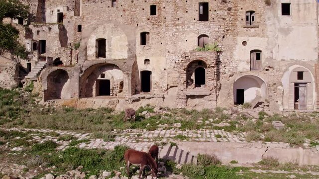 Aerial view of abandoned town with ruins on hill, Craco, Basilicata, Italy.