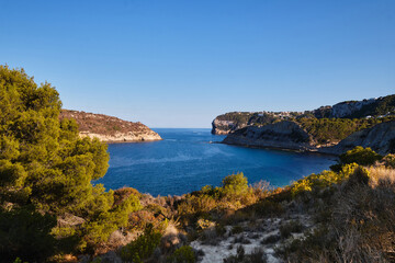 The landscape is a quiet rocky bay