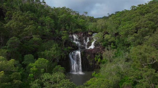 Rainy season Cedar Creek Falls Whitsundays Airlie Beach Proserpine Waterfall aerial drone Australia reserve Palm Grove QLD Queensland rainfall spring summer autumn winter sunny blue sky clouds static