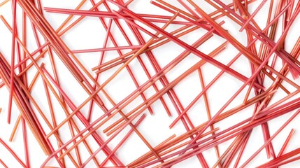 Obraz premium A collection of red sticks placed neatly on a white surface, ideal for use in still life photography or as a prop in creative projects