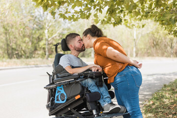 Gentle touch of married couple hands, of man with physical impairment and his wife. Disability,...