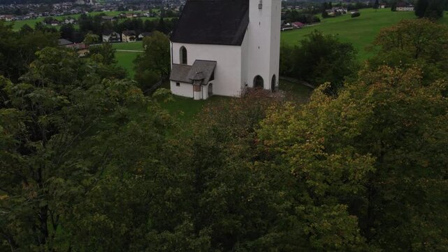Aerial view of Wallfahrtskirche church in mountain town during autumn, Golling an der Salzach, Salzburg, Austria.