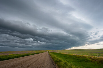 Rural gravel road under storm clouds near Yorkton, Saskatchewan, Canada