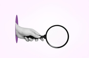 Hand hold magnifying glass on background