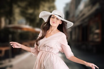 Young beautiful smiling woman in trendy summer dress.