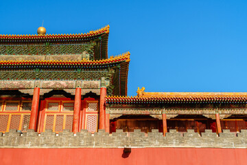 Naklejka premium Decoration Details of Yanchi Tower in Forbidden City under sun and blue sky