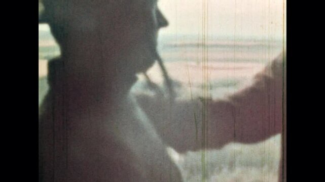 Man patted friend on shoulder, thanked for service, help, close up. Person looked at map. Cowboys in hats. Western retro archive. Wild west lifestyle. Vintage color film 1960s. Old-fashioned cinema