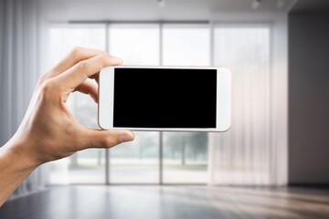 Business man using phone at home