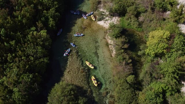 Aerial view of river with kayaks and boats in forest, Zrmanja, Croatia.
