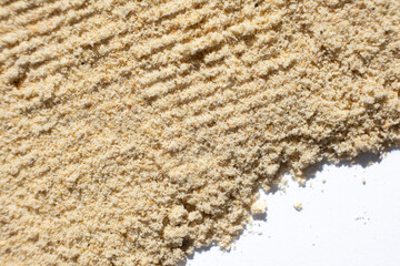 Abstract beige ground ginger background. Creativity in cooking.