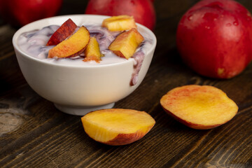natural yogurt in a white bowl with fruits