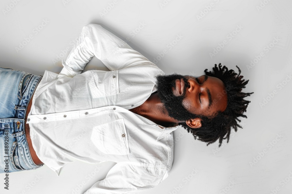 Poster a portrait of a man with a beard wearing a white shirt, suitable for use in editorial or commercial 
