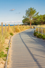 Coastal promenade along beach in Hel town on coast of Baltic Sea. Hel Peninsula is popular place for summer holidays. Hel, Pomerania, Poland