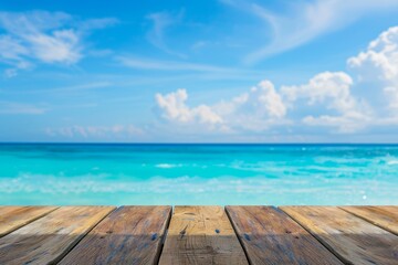Fototapeta premium An image of a wood table top against a blurry background of sparkling sea water and summer skies