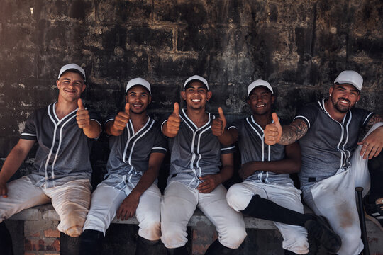 Sport, baseball or team portrait with thumbs up for support, diversity or ready for game. Community outreach, group of men or hand gesture in dugout for yes, motivation and training program in USA