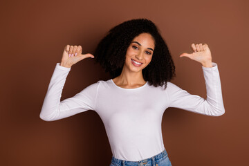 Photo of pretty young girl point fingers hair wear pullover isolated on brown color background