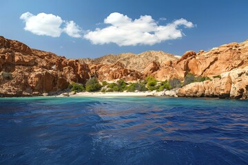 Fototapeta premium View from the sea to a rocky beach and a reef on the Red Sea coast