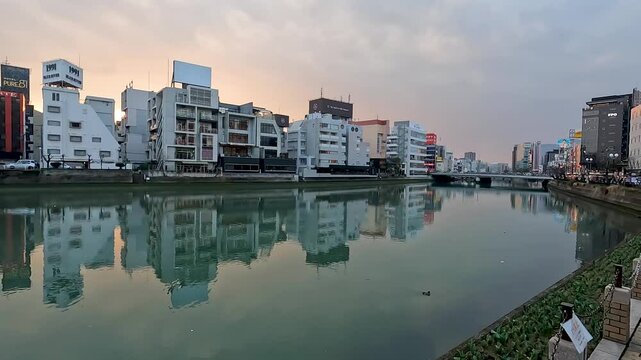 Landscape Fukuoka City with Nana River  in Hakata  and Tenjin - Street and Building on the Fukuoka City , Kyushu Japan 