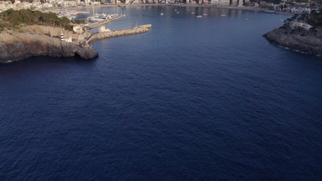 Aerial view of stunning sunset over the coastal town of Soller, Mallorca, Spain.