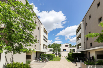 Residential area with ecological and sustainable green residential buildings, low-energy houses with apartments and green courtyard