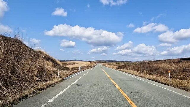 Landscape Milk road at Mount Aso is  Aso Volcano and in this sense is the largest active volcano in Aso Kumamoto Japan - golden dry grass meadow Dolly in Footage , travel Nature Outdoor 