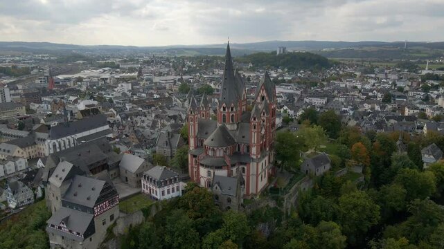 Aerial view of medieval castle, church, and cathedral overlooking river in historic Limburg an der Lahn, Germany.