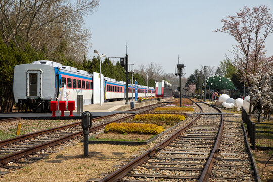 Gongneung-dong, Nowon-gu, Seoul, South Korea - April 7, 2023: Morning view of cabin train parked on railroad besides platform at Hwarangdae Railway Park
