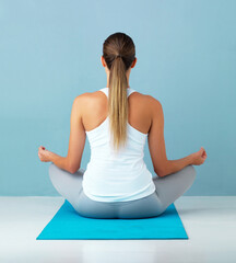 Yoga, woman and meditation with back on mat for holistic wellness, breathing exercise and balance...