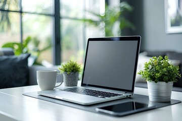 A laptop computer sitting on top of a white table