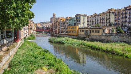 Girona, Spain - 18 July, 2024: Colorful buildings along the River Onyar, Girona, Catalonia