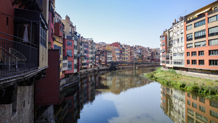 Girona, Spain - 18 July, 2024: Colorful buildings along the River Onyar, Girona, Catalonia