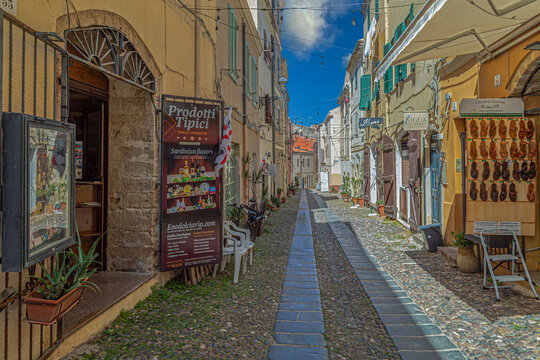 Picturesque street typical Sardinian, with small traditional souvenir shops, Alghero, Sardinia, Italy