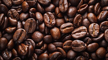 A close-up shot of a pile of coffee beans, great for food or product photography