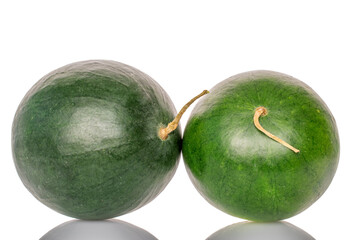 Two ripe sweet watermelons, macro, isolated on white background.