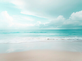 Fototapeta premium A peaceful beach scene showcasing soft, gentle waves lapping up onto a sandy shore, under a slightly cloudy sky, creating a serene and calming atmosphere.