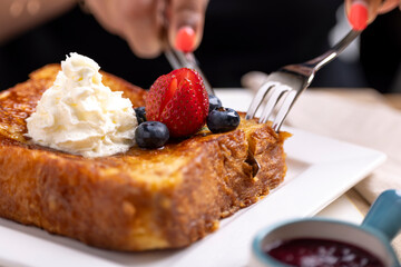 Indulge in the classic delight of homemade French toast. Thick slices of bread soaked in a rich, creamy mixture of eggs, milk, and a hint of vanilla, then perfectly browned on a hot griddle