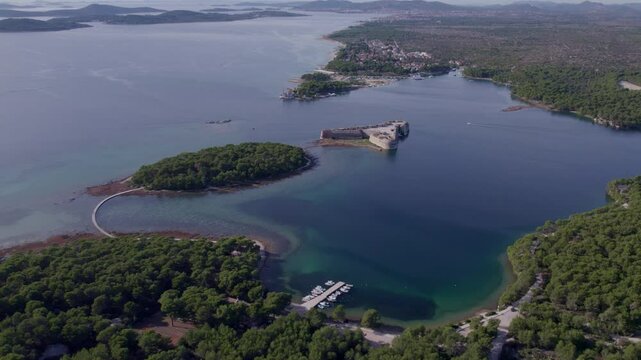 Aerial view of St. Nicholas fortress, island, and serene blue water, Zablace, Sibenik, Croatia.