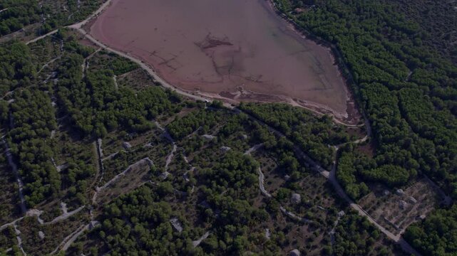 Aerial view of pink lake and town, Zablace, Sibenik, Croatia.