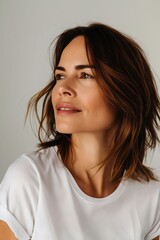 Fototapeta premium A woman with brown hair looking up.
