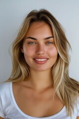 Naklejka premium A beautiful woman with long blonde hair smiling.