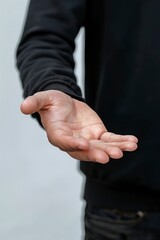 Fototapeta premium Man holding something in hand on white background