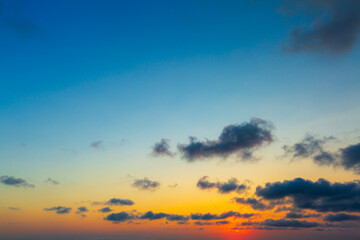 Fototapeta premium Morning clouds and sky background,Real majestic sunrise sundown sky background with gentle colorful clouds without birds. Panoramic, big size