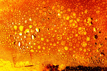 Macro beer bubbles,Refreshing drinks. Glass of cold beer and water drops on it, macro